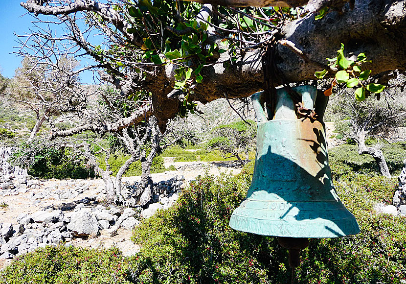The church bell for the church of Panagia in Lissos hangs in a tree.