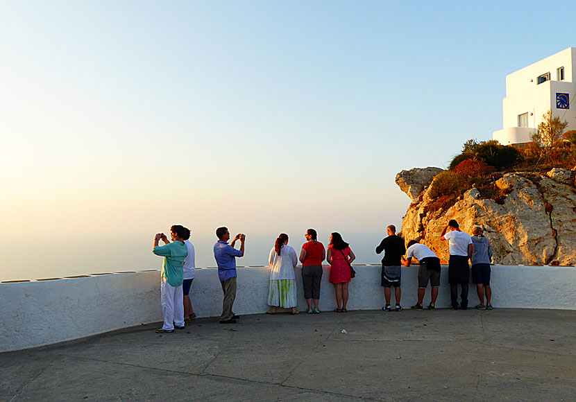 Expectant tourists at Pounta Square waiting for the sunset on Folegandros.