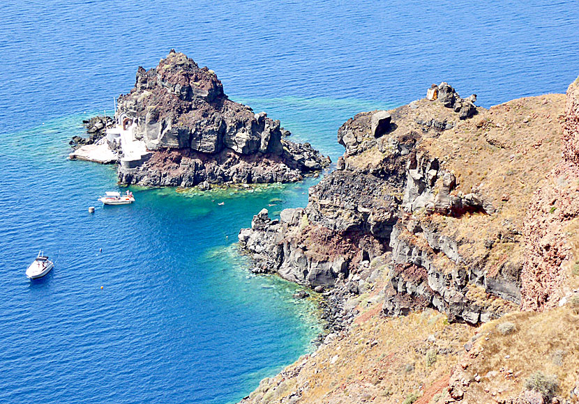The church and rock bath of Agios Nikolaos to the left of Amoudia on Santorini.
