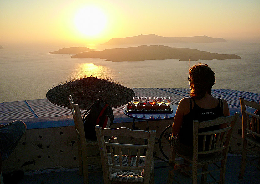 Sunset seen from Santo Wines above the port of Athinios in Santorini.