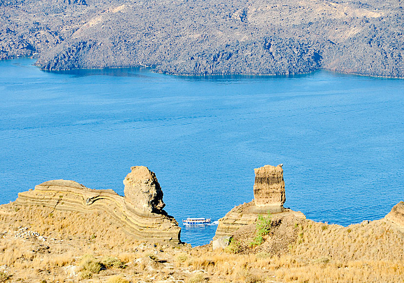 The volcanoes Nea Kameni and Palia Kameni on Santorini seen from a vantage point above the port.