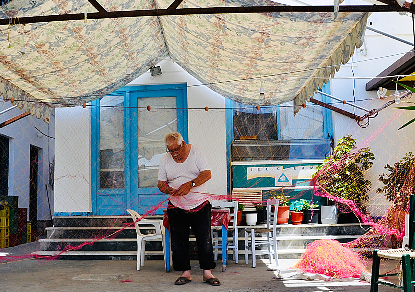 A Greek fisherman works with his net after the morning's fishing trip outside Agnontas.