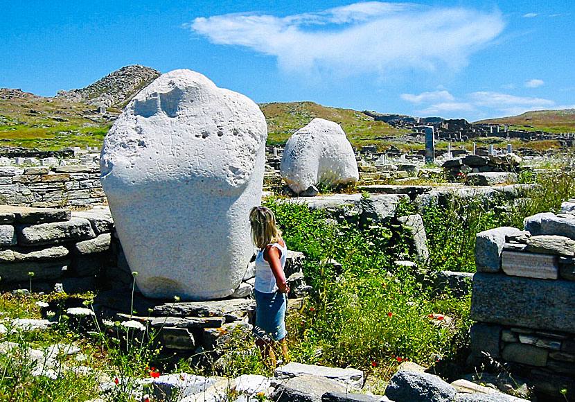 Remains of ancient statues with giant torsos on Delos near Mykonos.