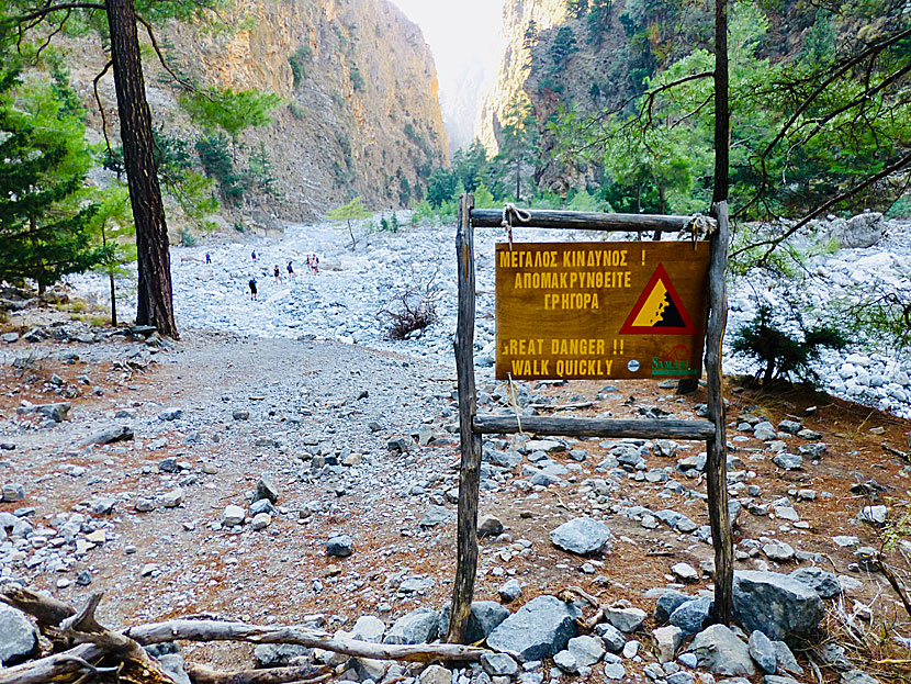 Warning signs for lots of rocks and boulders in the Samaria Gorge in Crete.