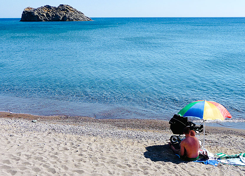 Sunbeds and umbrellas in Greece with rainbow colors.