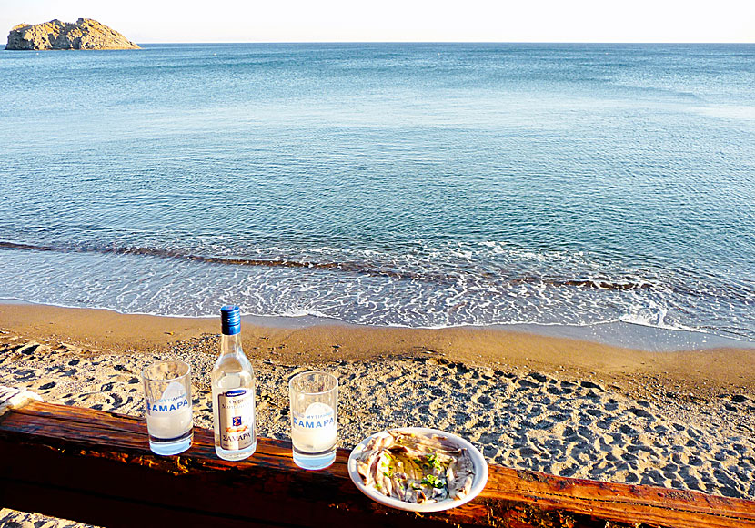 An Ouzo Zamara and a plate of Gavros Marinatos on the beach promenade in Skala Eressos.