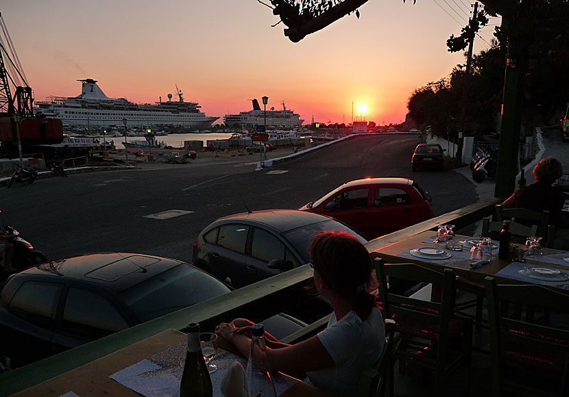 Cruise ships and sunset in the port of Mykonos.