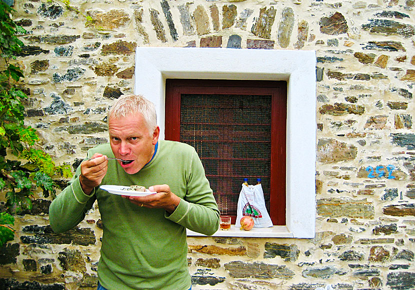 Eating pork belly and drinking local wine on Naxos in Greece.
