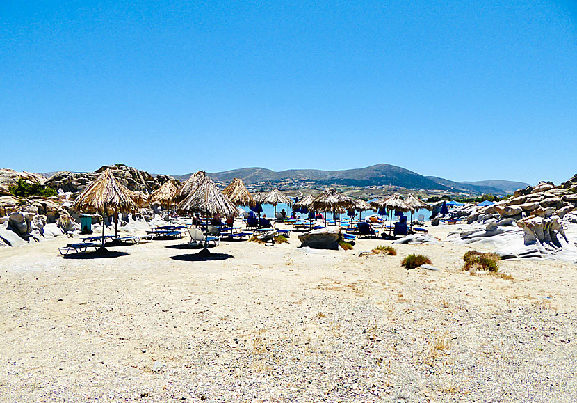 Expensive sunbeds and umbrellas for rent at the sandy beach of Kolymbithres.