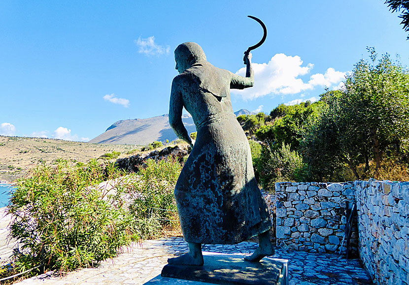 Statue of an angry woman in the parking lot outside Diros Caves.