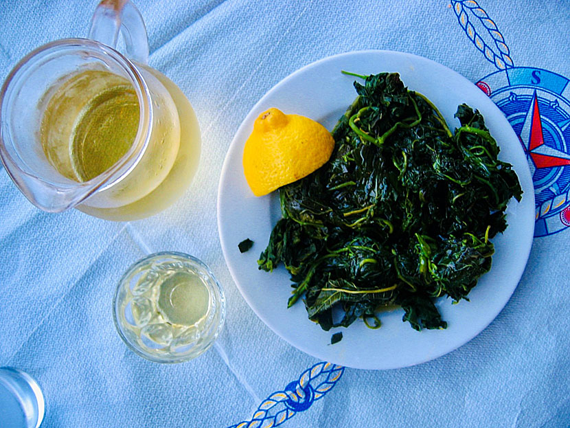 Starters and appetizers from Greece. Boiled greens - Chorta - with olive oil and lemon.