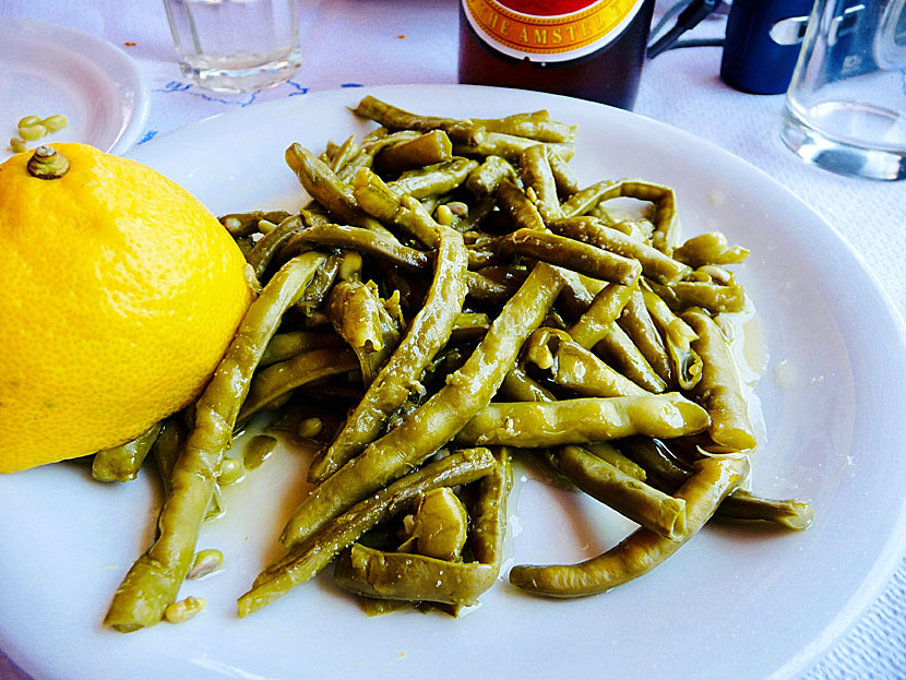 Starters and appetizers from Greece. Green beans - Fasolakia - with olive oil, lemon and spices.