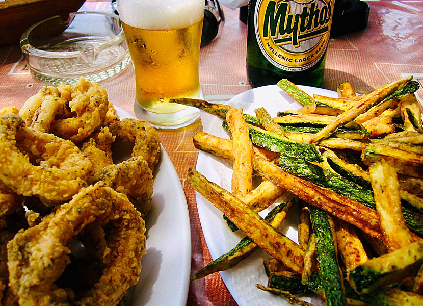 Starters and appetizers from Greece. Fried Calamari and fried zucchini.