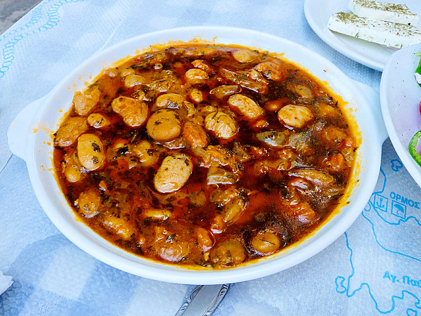 Starters and appetizers from Greece. Baked giant white beans - Gigantes - with tomato, onion and dill.