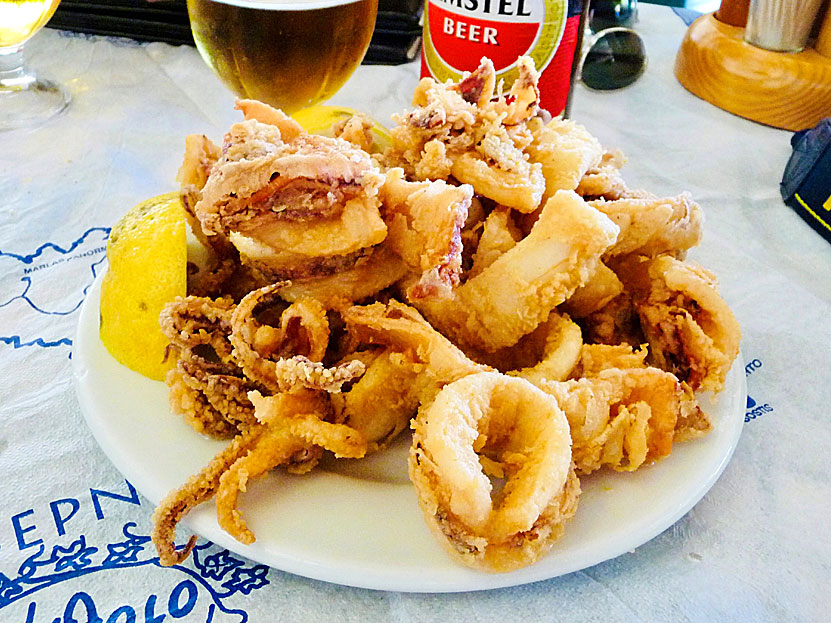 Main dishes from Greece. Fried squid - Kalamari tiganito - served with lemon.