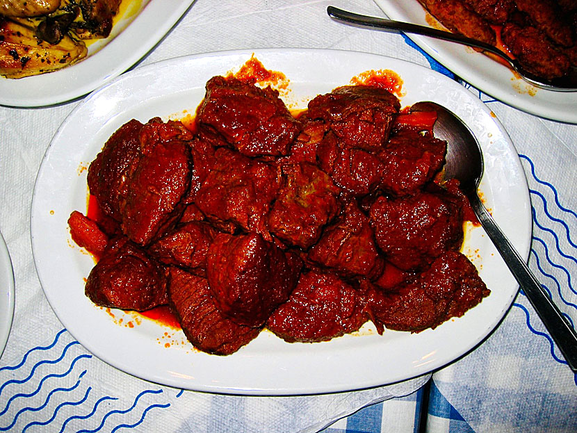 Main dishes from Greece. Beef in tomato sauce - Moshari Kokinisto is a stew made from pieces of steak that are cooked for a long time in a tomato sauce.