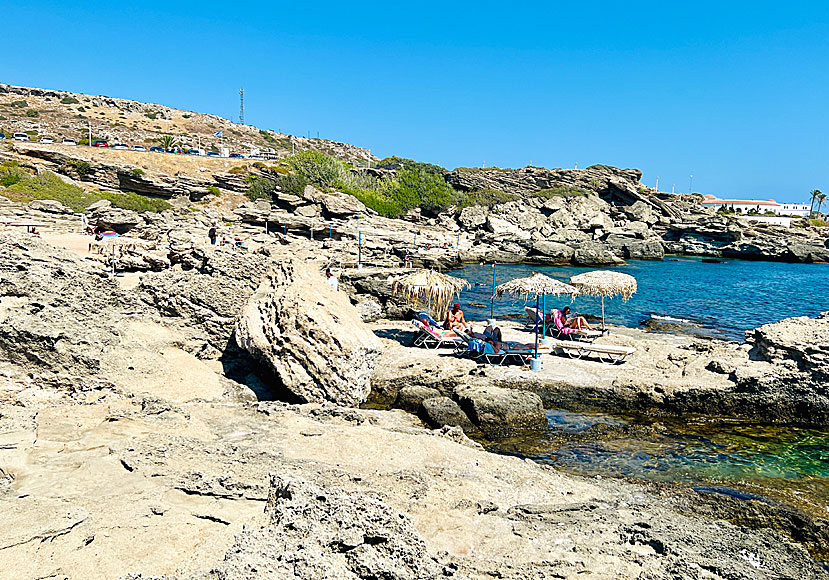 Beach rocks and sunbeds at Kokkina beach south of Rhodes town.