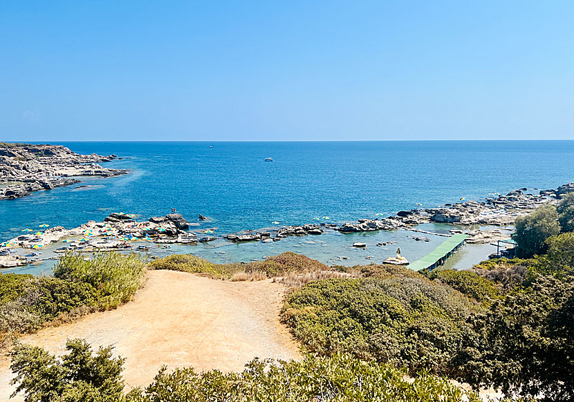 Nikolas beach near Rhodes town with its bathing rocks, fine snorkeling waters and taverna.