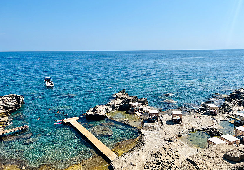 Bathing jettys and expensive sunbeds at Oasis beach in Rhodes.