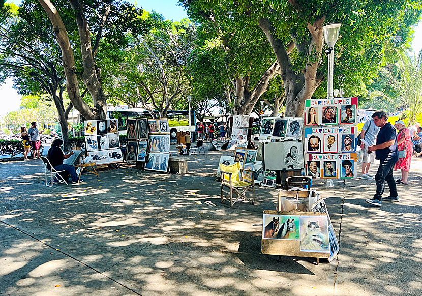 Caricature artist in Mandraki harbour in Rhodes town.