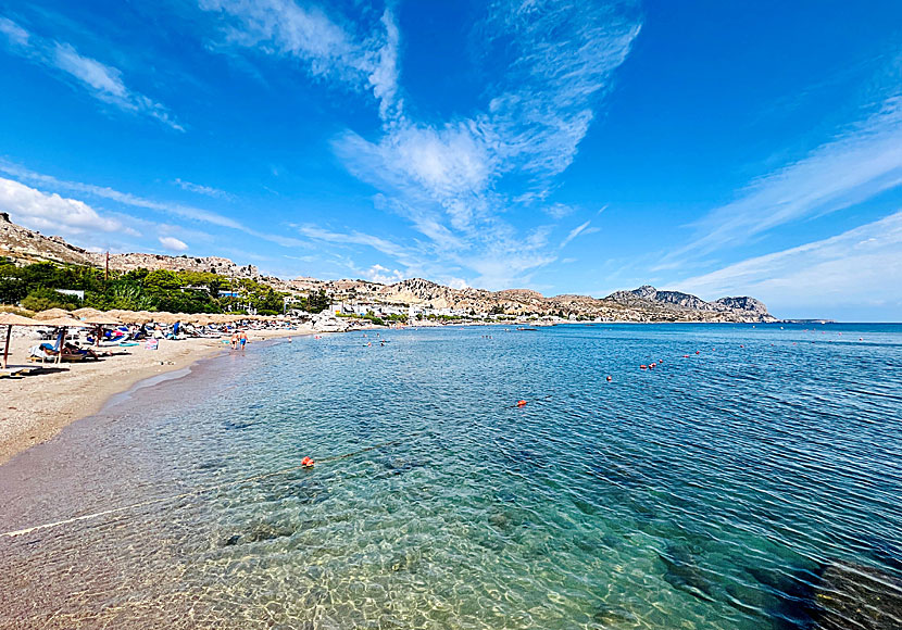 The sandy beach in Stegna stretches through the entire bay and ends at a cute marina.