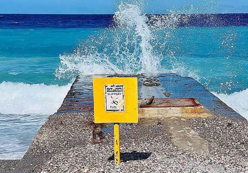 Waves on the breakwater and pier at Windy beach.