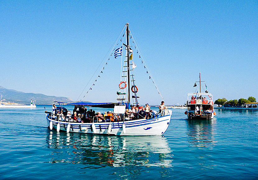 Excursion boats heading to the port of Pythagorion after a day at sea and the small island of Samiopoula.