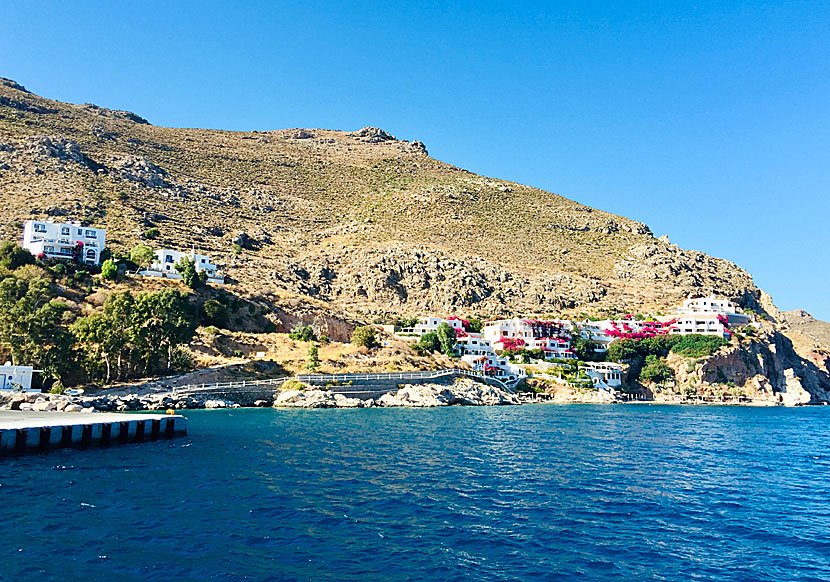 To the right of the port is Ilidi Rock surrounded by bougainvillea.