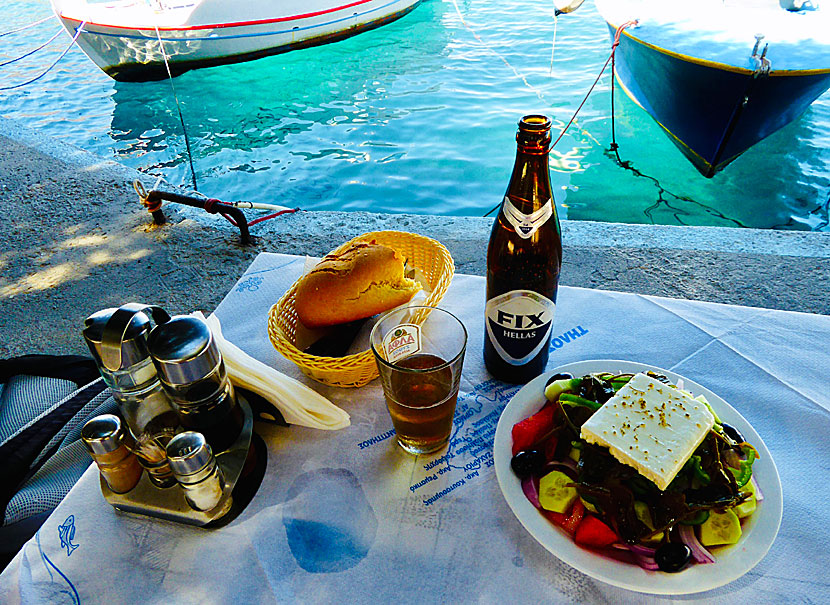 Have dinner at Taverna To Delfini in Agios Antonios and watch the sunset.