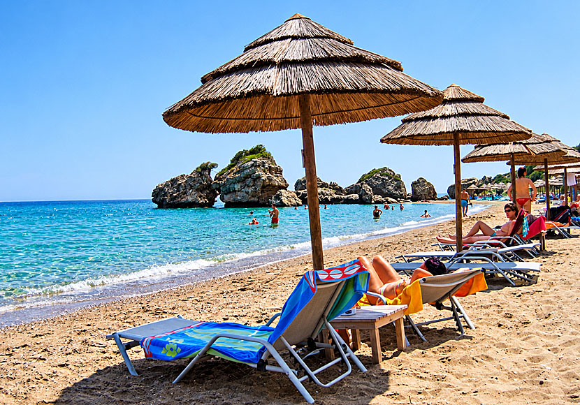 Sunbeds and parasols at Porto Zoro Beach near Argassi on Zakynthos.
